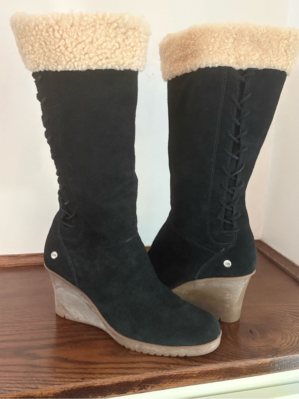UGG Felicity wedge boots featuring black suede and a shearling trim